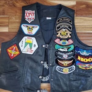 VINTAGE biker vest with Harley patches. Not sure it still has vest extenders